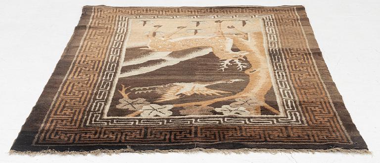 A figural semi-antique rug, China, c. 169 x 117 cm.