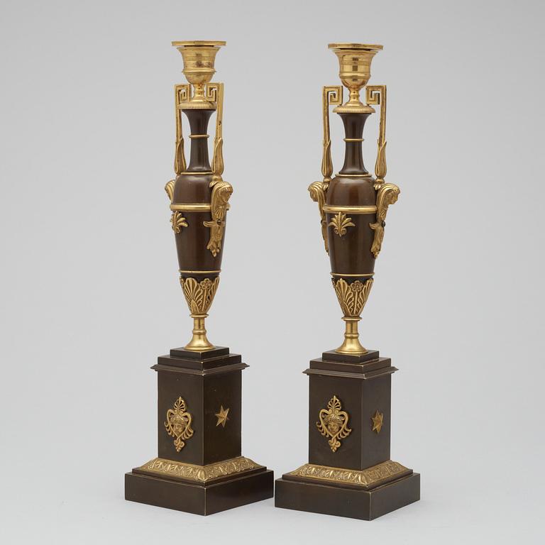 A pair of Empire early 19th century candlesticks.