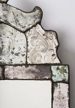 A Northern European late baroque engraved glass mirror, first part 18th century.