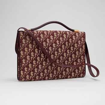 CHRISTIAN DIOR, a red monogram canvas shoulder bag.