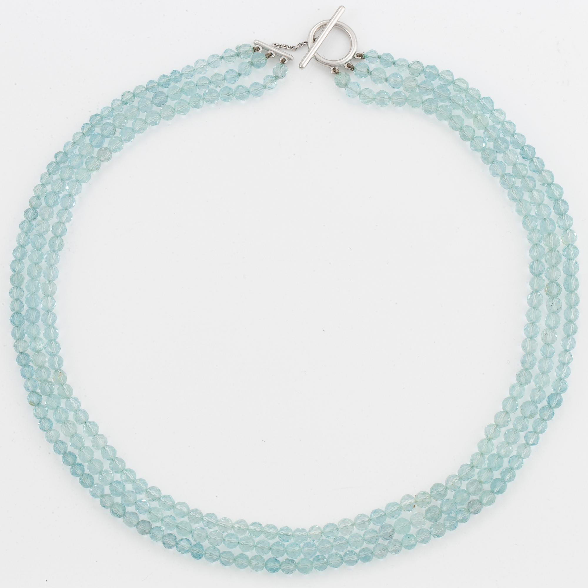 A Tiffany & Co three strand faceted aquamarine bead necklace with an 18K white gold clasp.