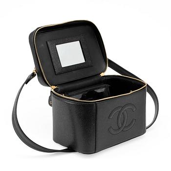 CHANEL, a black caviar leather beauty case.