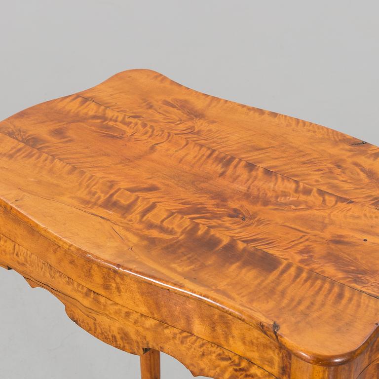 A Rococo style table late 19th century.