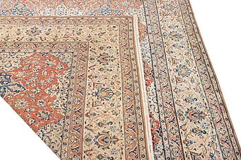 A semi-antique/old Nain carpet, part silk, c. 343 x 230 cm.