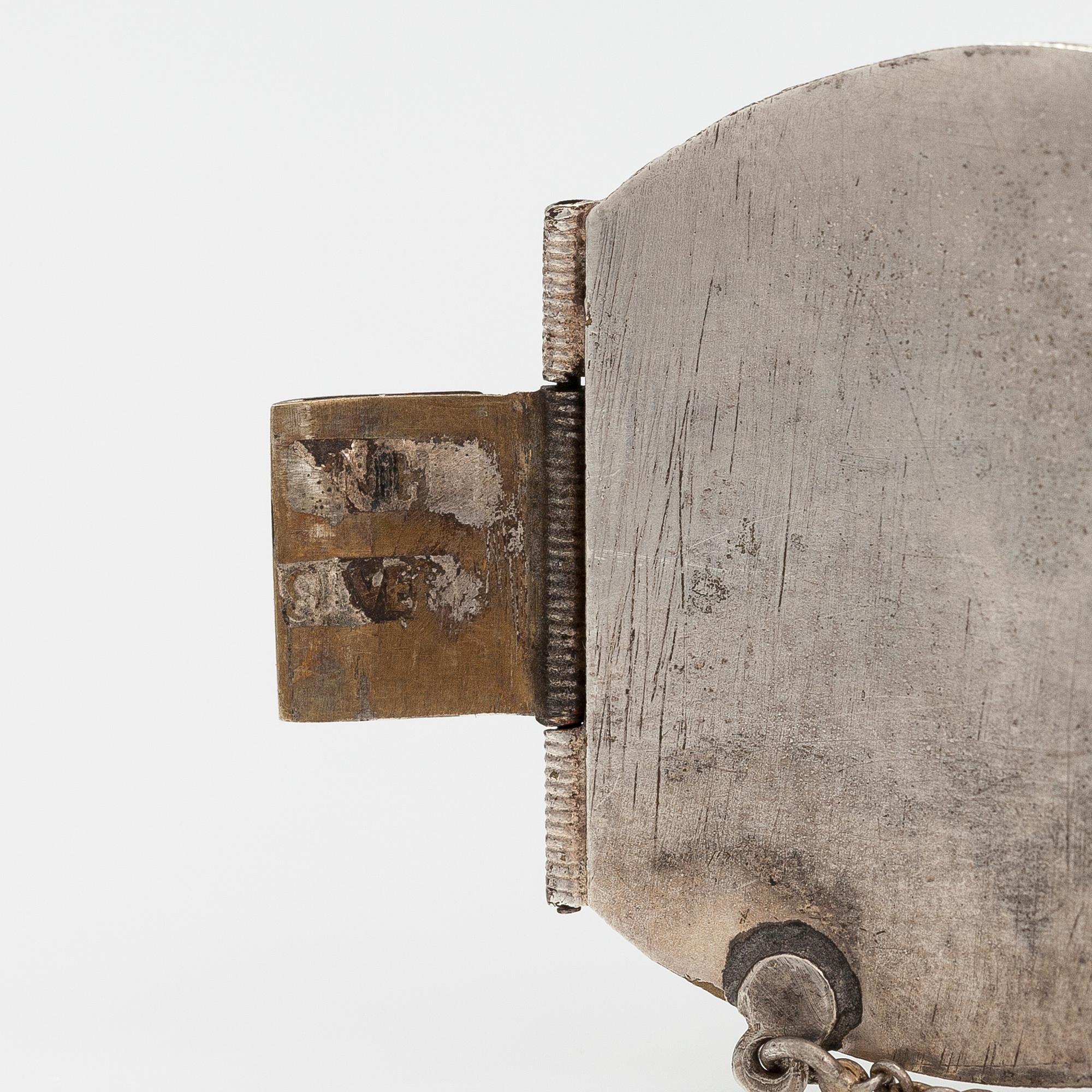 A silver bracelet with corals.
