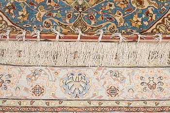 An oriental, silk rug, signed, c. 175 x 125 cm.