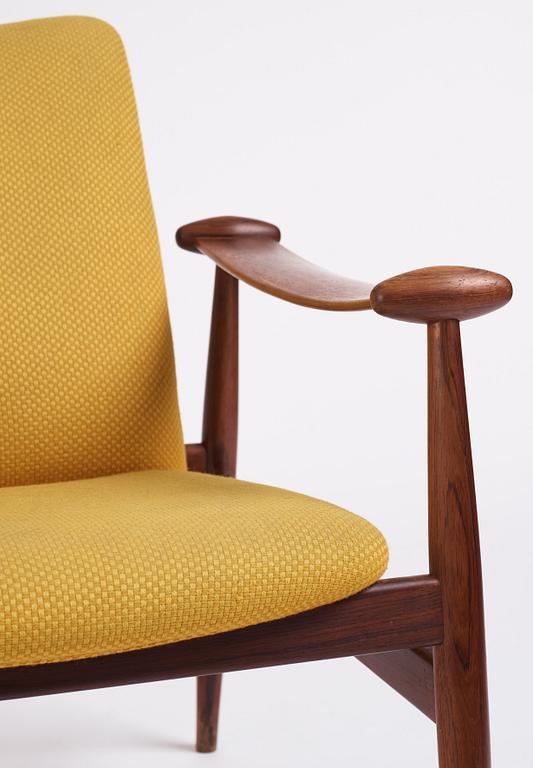 Finn Juhl, a 'model F-133' rosewood easy chair by France & Son, Denmark 1960s.