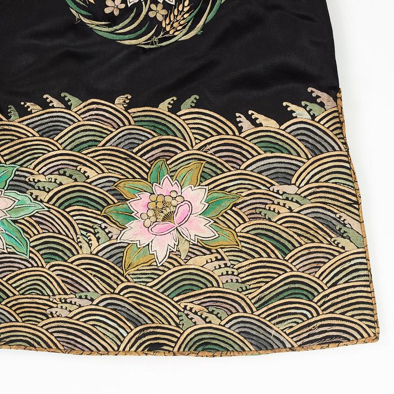 A Chinese embroidered silk robe, height 68 cm, 1920s.