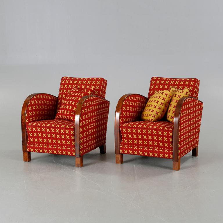 A pair of 1930s armchairs.