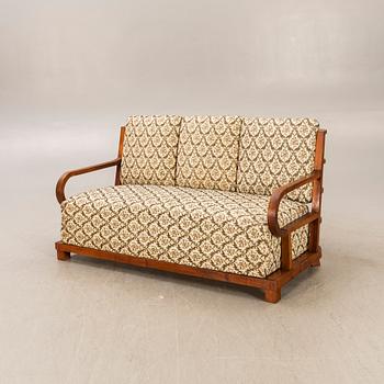 An Art Deco walnut sofa first half of the 20th century.