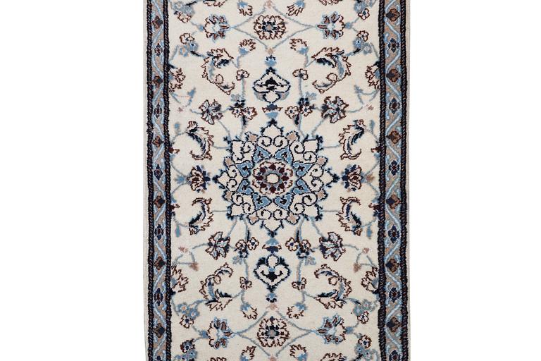 A runner carpet, Nain, part silk, 9 laa, signed, ca. 380 x 80 cm.