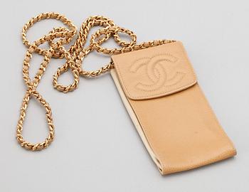 1215. A beige leather case by Chanel.
