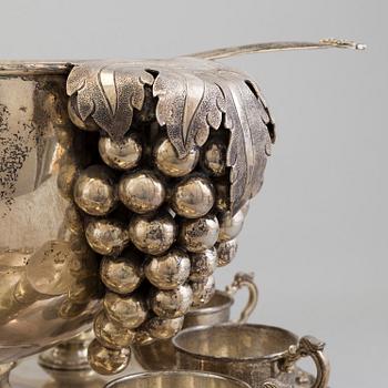 A first half of the 20th century silver punch bowl with twelve cups.