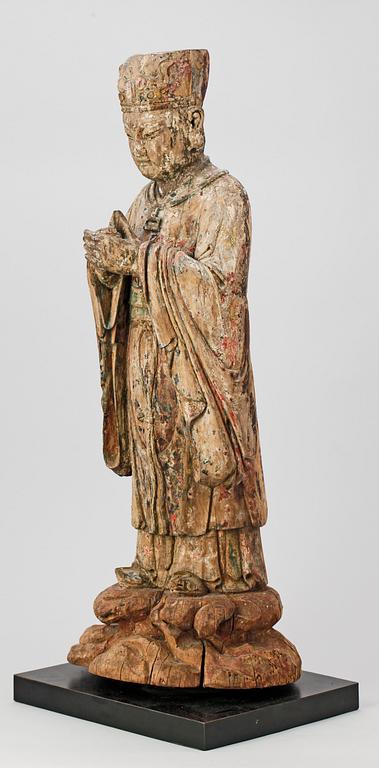 A wooden sculpture of a deity, Ming style.