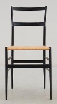 A Gio Ponti 'Superleggera' chair, Cassina, Italy, black painted ash with ratten seat.