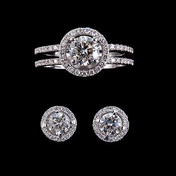 68. A RING AND A PAIR OF EARRINGS, brilliant cut diamonds. 1.00 ct + 0.35 ct. in ring. 0.80 ct. in earrings.