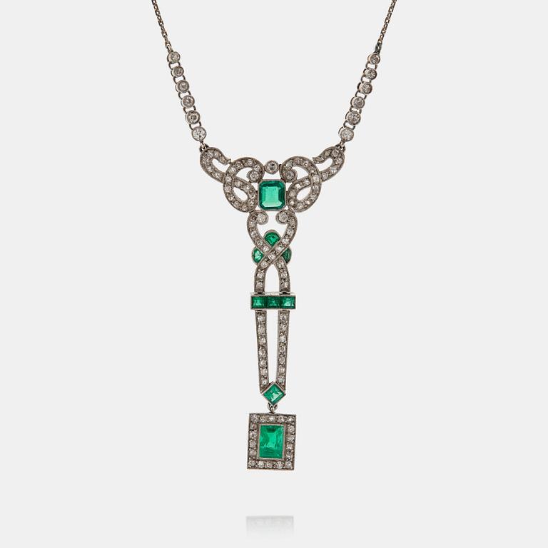 A platinum necklace set with faceted emeralds and old- and eight-cut diamonds.