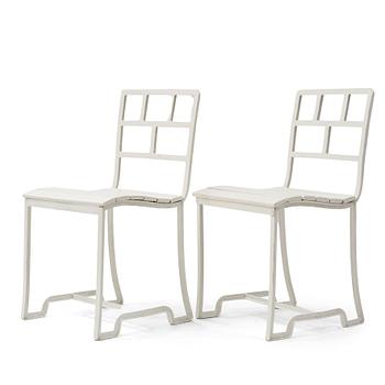 256. Carl Hörvik, a pair of white lacquered iron garden chairs, possibly manufactured by Thulins vagnsfabrik, Sweden.