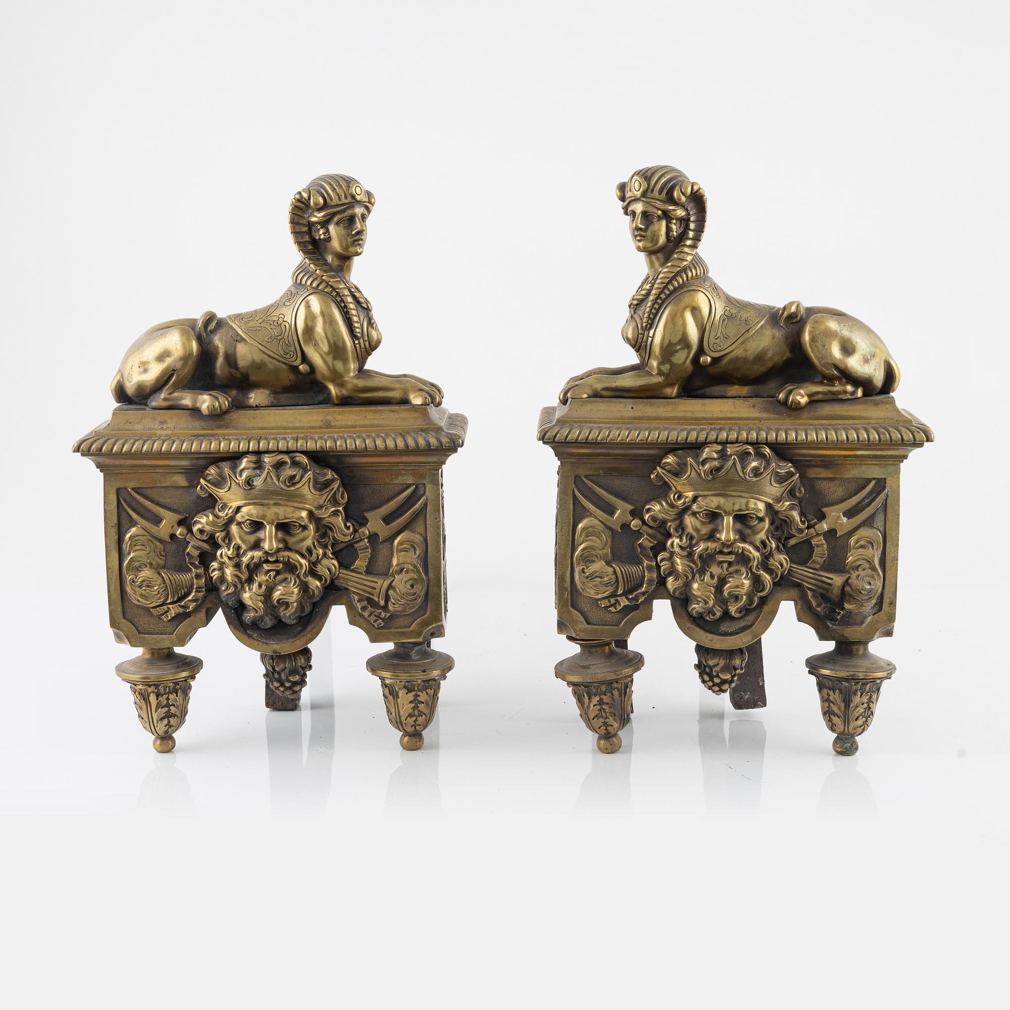 A pair of French 19th century bronze fire dogs.