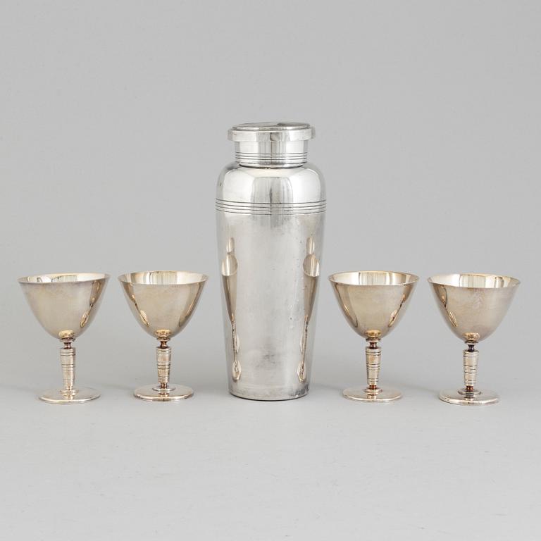 A mid 20th century silver plated shaker and four glasses.