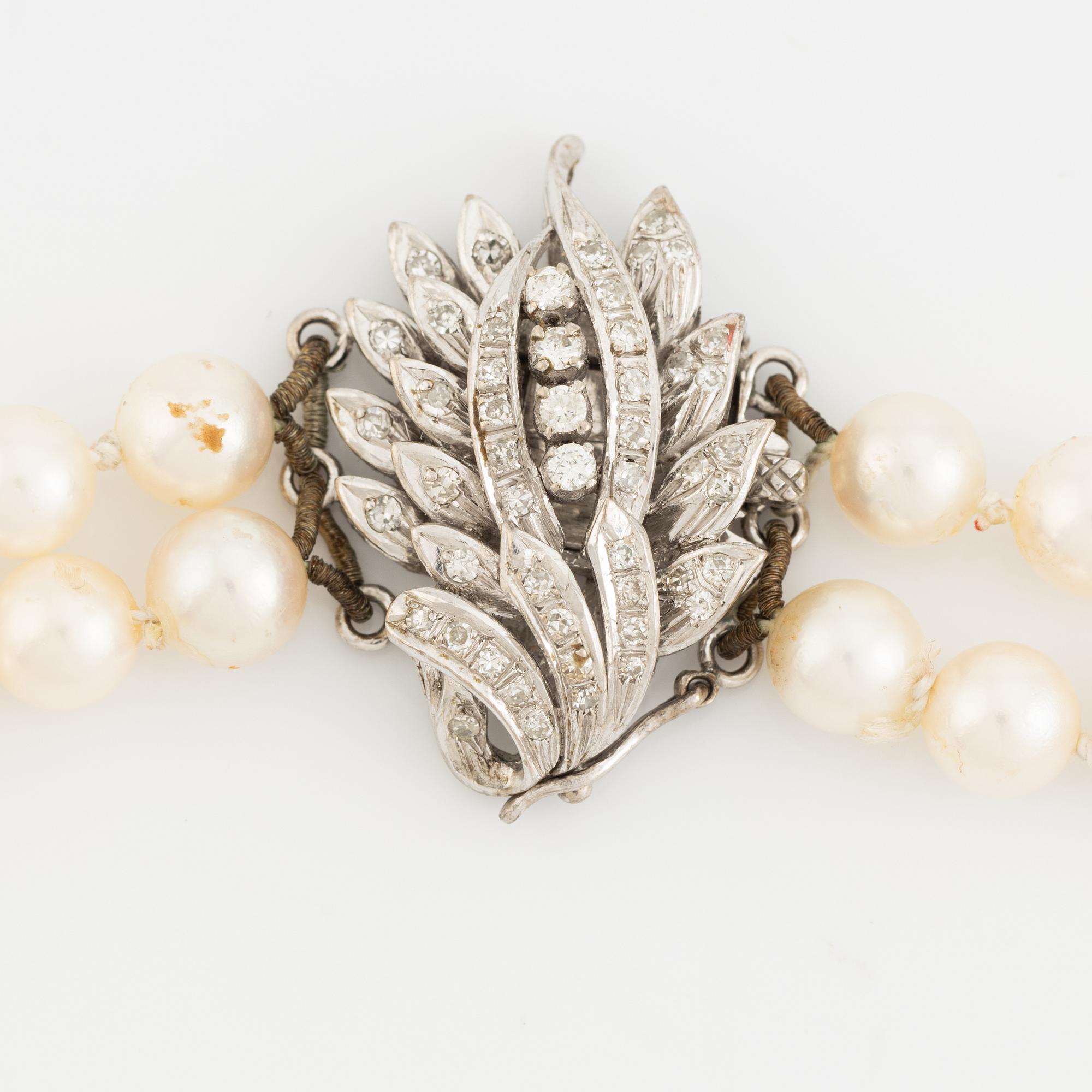 Two strand cultured pearl necklace, clasp with diamonds.