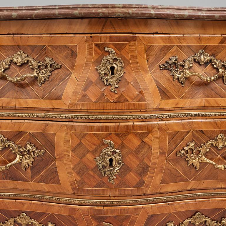 A rosewood-veneered and ormolu-mounted Rococo chest of drawers by J. Wahlbeck (master 1760-1782).