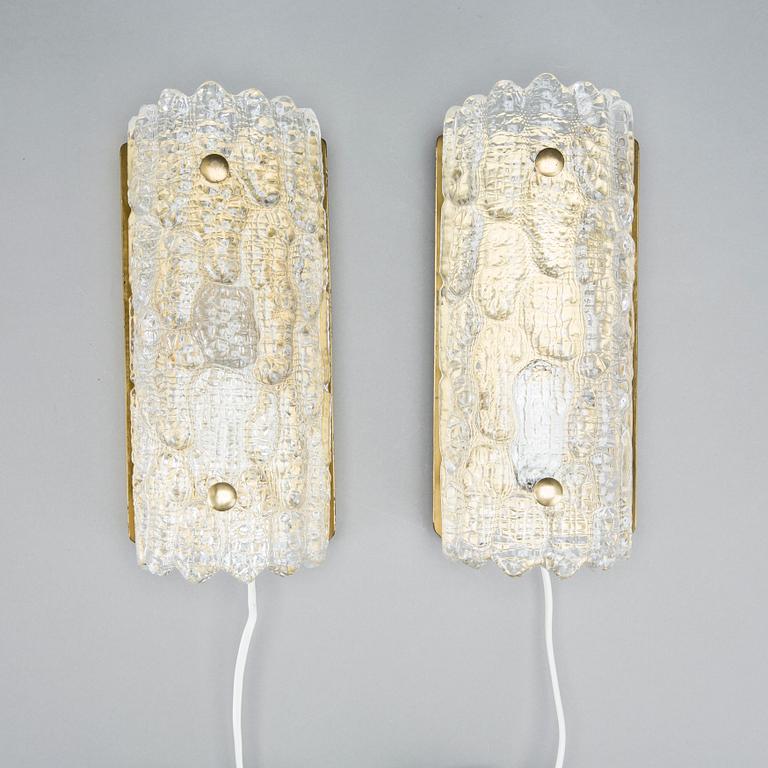CARL FAGERLUND, a pair of glass and brass Orrefors wall lamps.