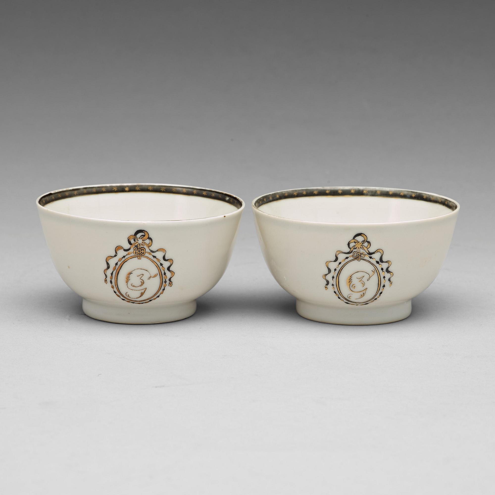 A pair of armorial grisaille cups, Qing dynasty, Qianlong (1736-95).