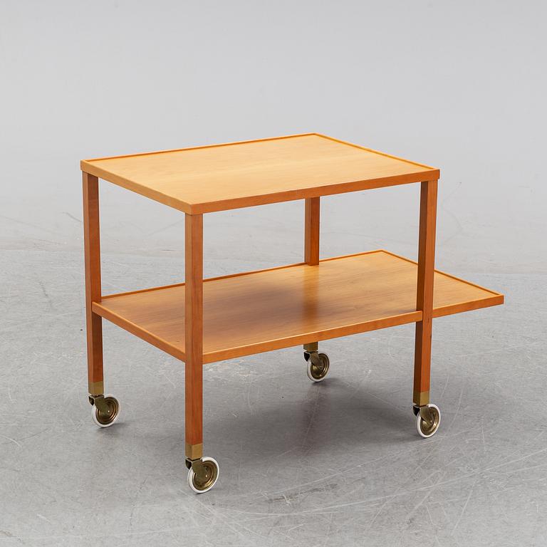 A walnut drink cart designed by Josef Frank for Firma Svenskt Tenn.