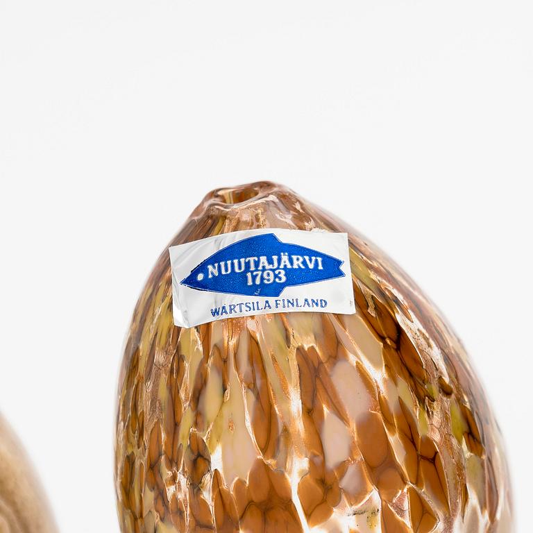 A set of 10 glass and stone decorative eggs.