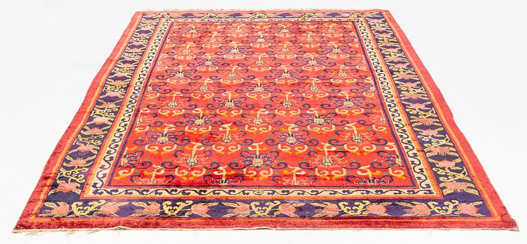 An East Turkestan silk carpet, ca 308 x 182 cm.
