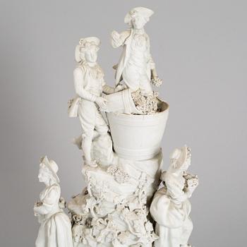 A biscuit porcelain figure group, circa 1900.