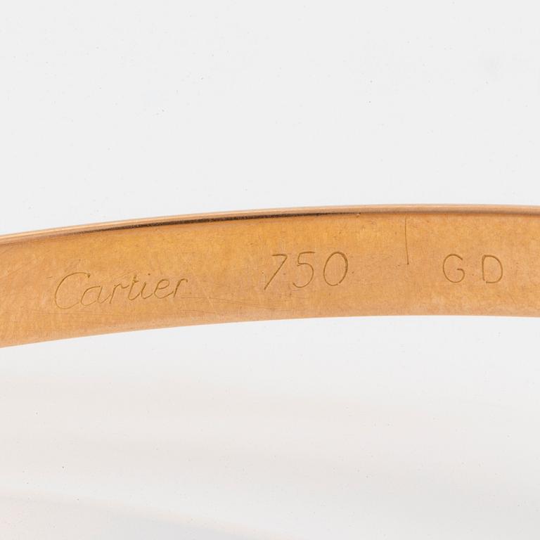 A Cartier "Trinity" bangle.