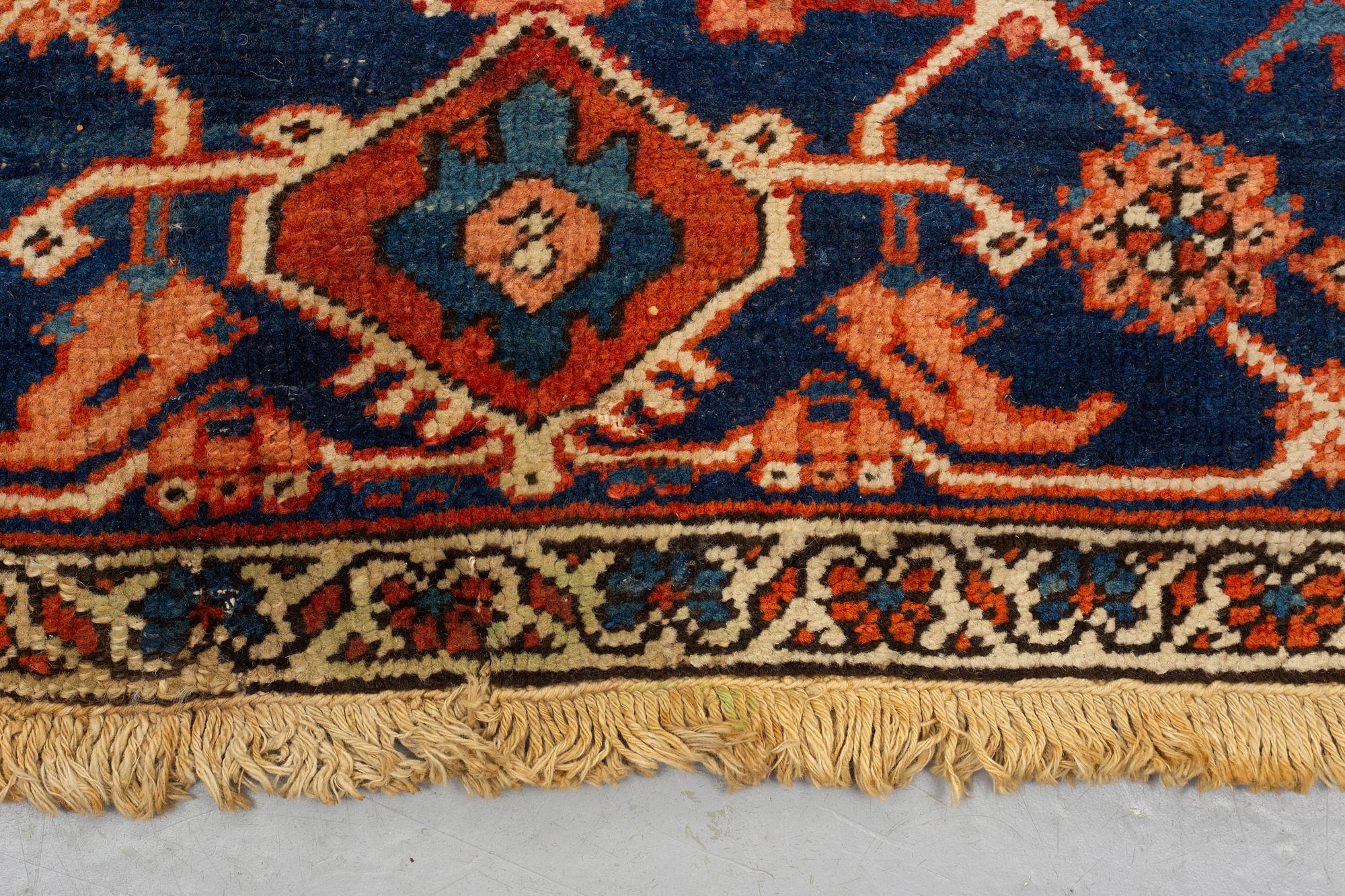 A carpet, an antique Heriz, ca 469,5-471 x 300-309,5 cm.