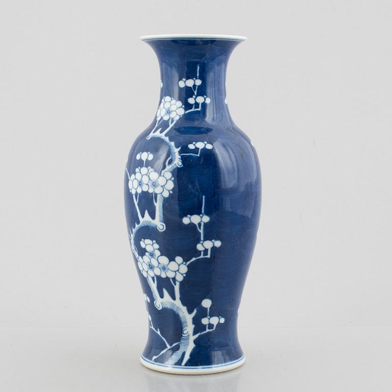 A Chinese porcelain dragon bowl, Qing dynasty, 19th century, and a blue and white porcelain vase, China, 20th century.