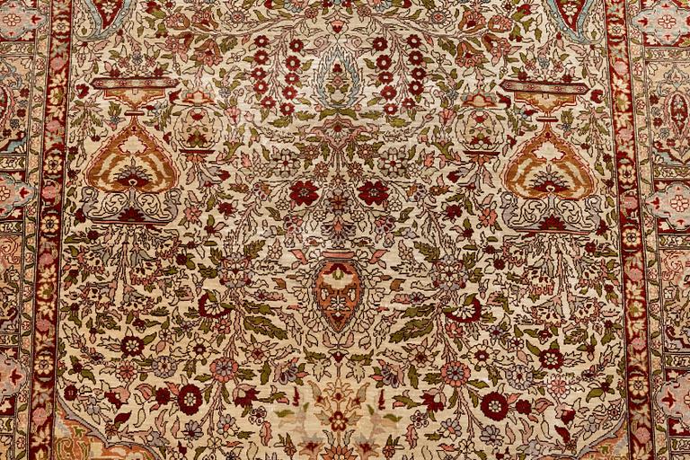 A rug, Old silk Hereke, ca 152 x 110 cm.