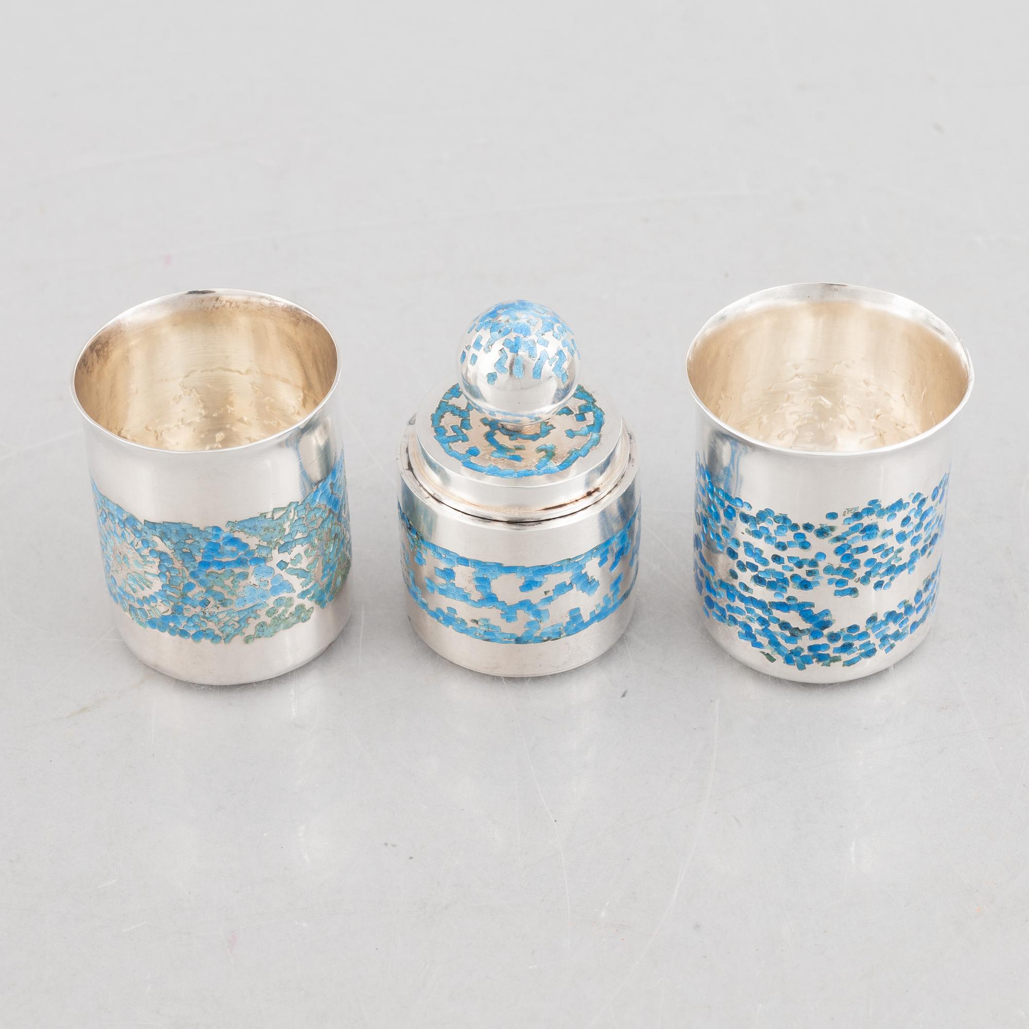 Two sterling silver and enamel miniature beakers and a small box with lid, marks of Lars Arby, Gothenburg, Sweden.