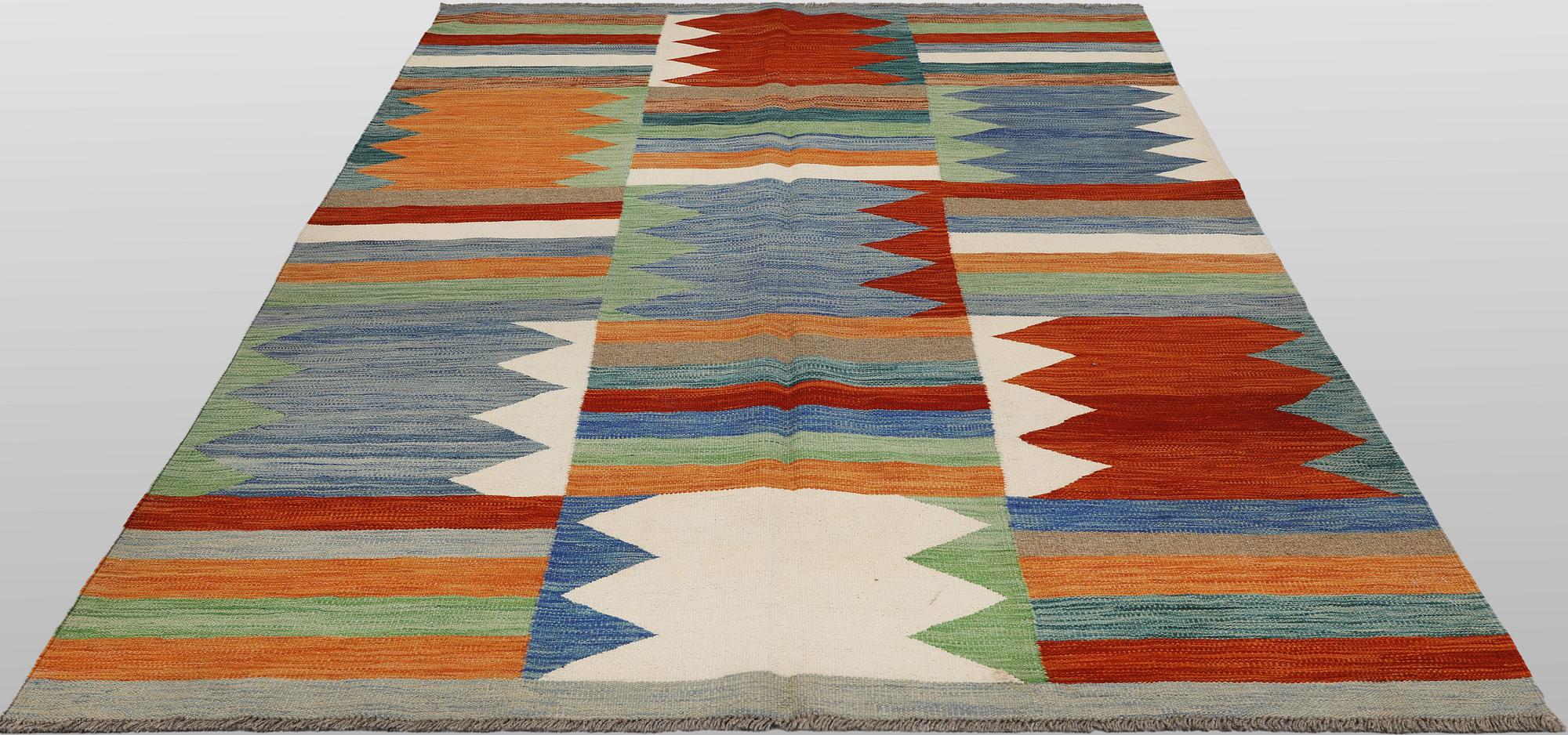 A Kelim carpet, c. 242 x 178 cm.