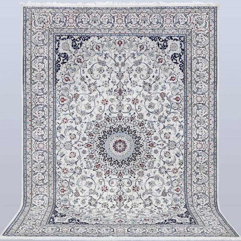 A Nain carpet, part silk, so called 6LAA, approximately 279 x 200 cm.