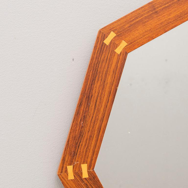 A Sigvard Bernadotte jacaranda mirror for Aktuell Form later part of the 20th century.