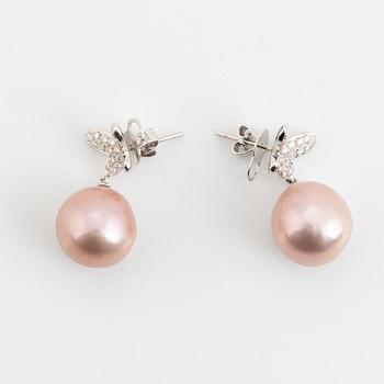 Pink freshwater pearl and brilliant cut diamond butterfly earrings.