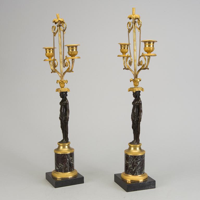 A pair of 1800s empire candelabras.
