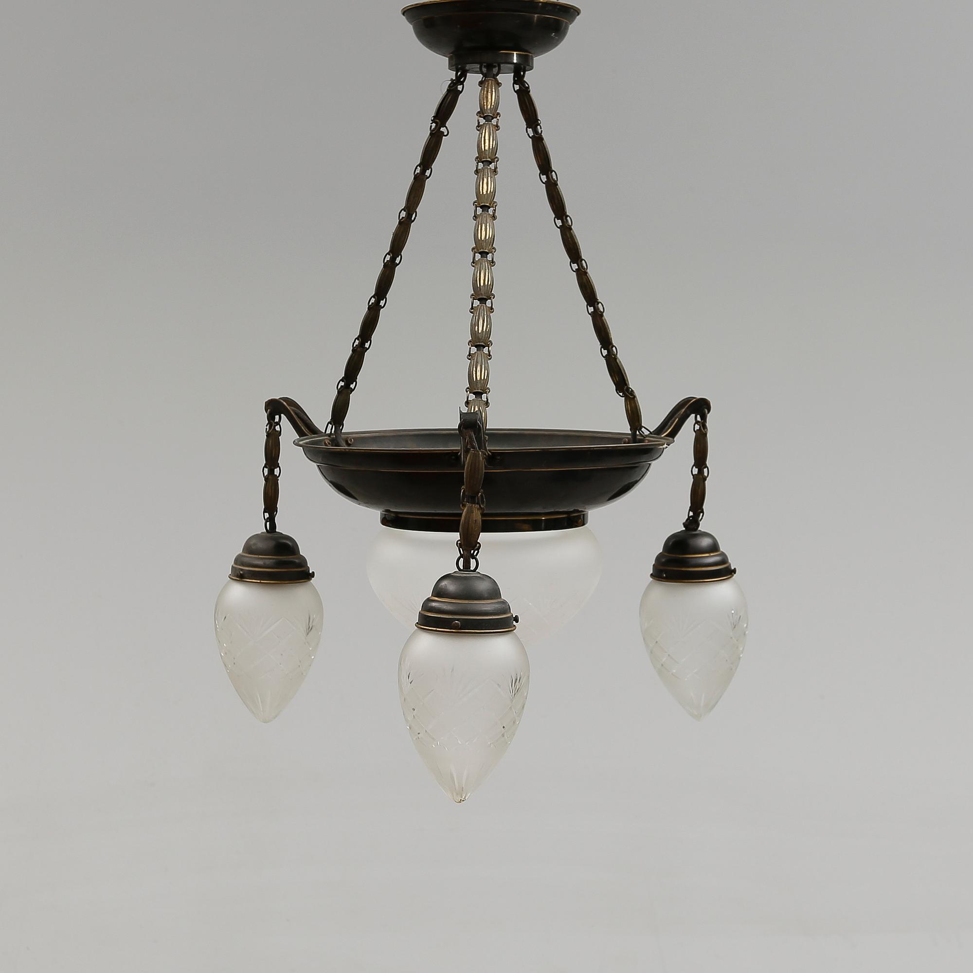 TAKLAMPA, 1900-talets första hälft.