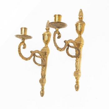 A pair of 'Törne' brass one-light wall ligths from IKEA's 18th Century collection.