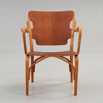 A Carl-Axel Acking beech and mahogany armchair, Svenska Möbelfabrikerna, Bodafors 1940's.