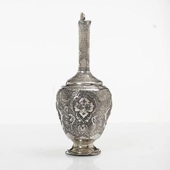 A Persian silver pitcher with five stemmed cups and a beaker, first part of the 1900s.
