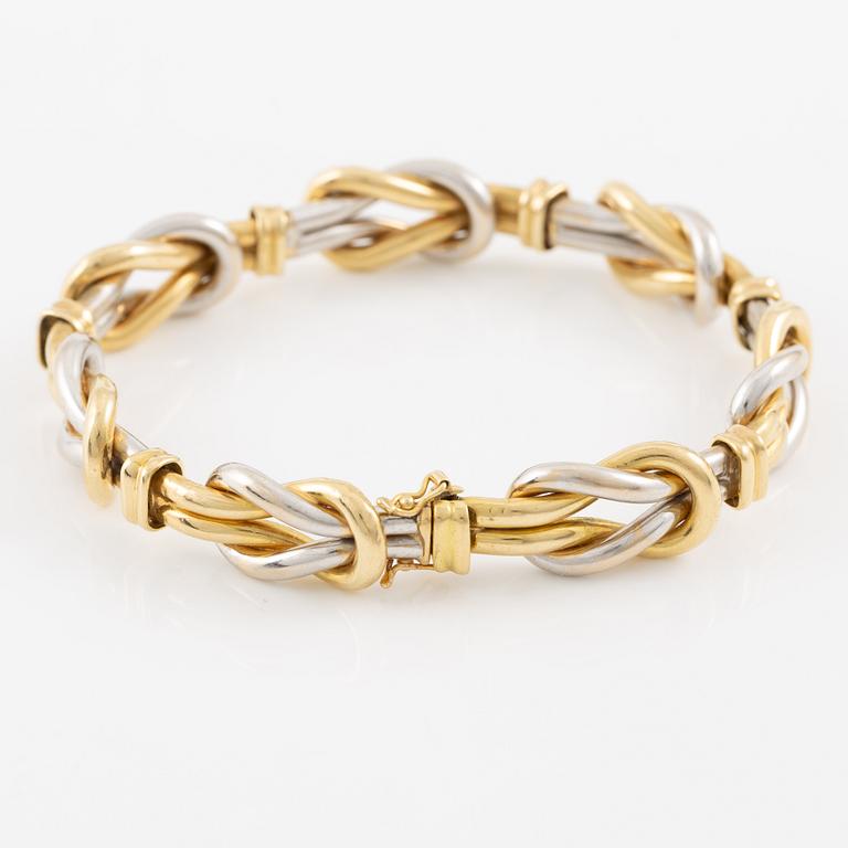 A bracelet in 18K gold and white gold.