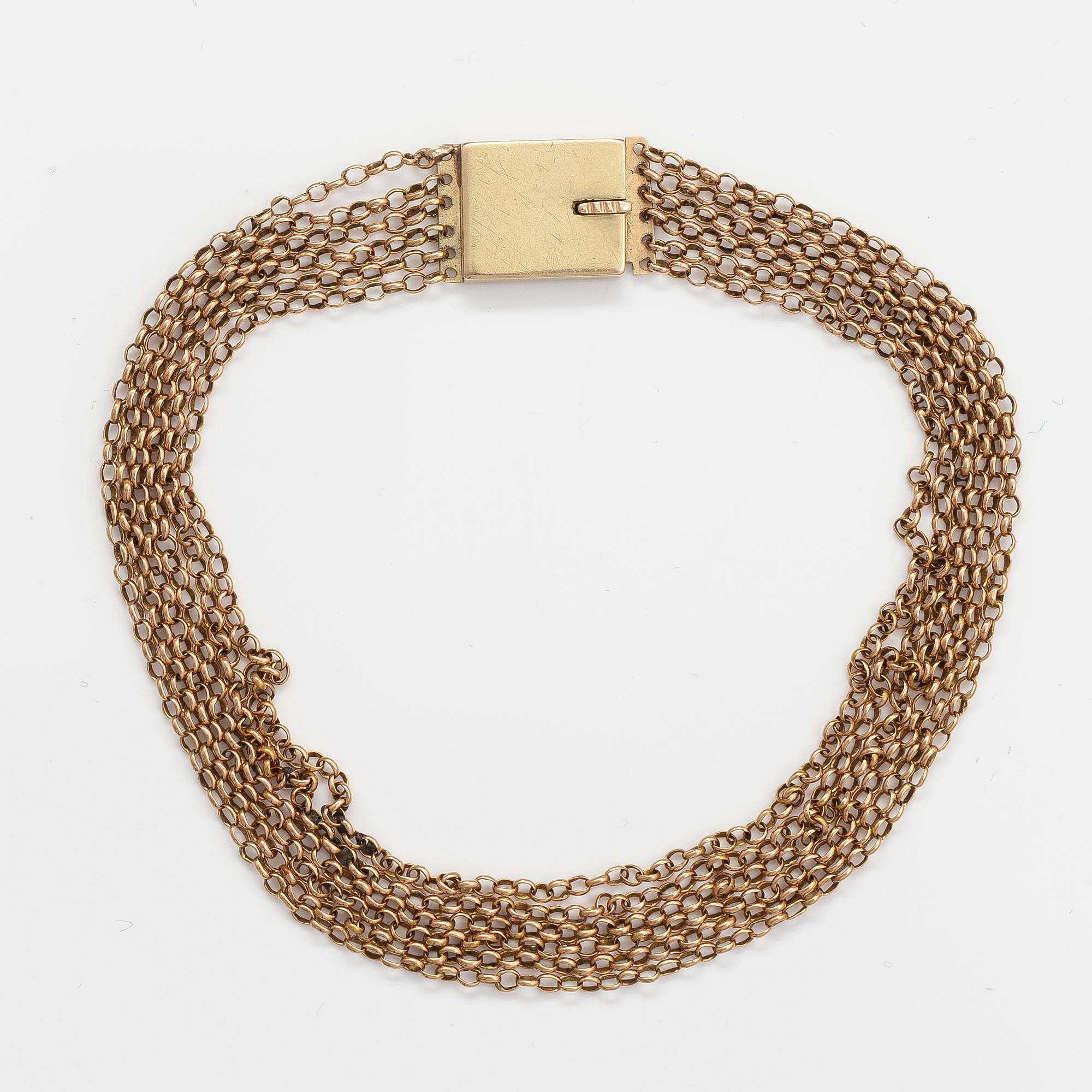 An 18K and 14-18K gold bracelet.