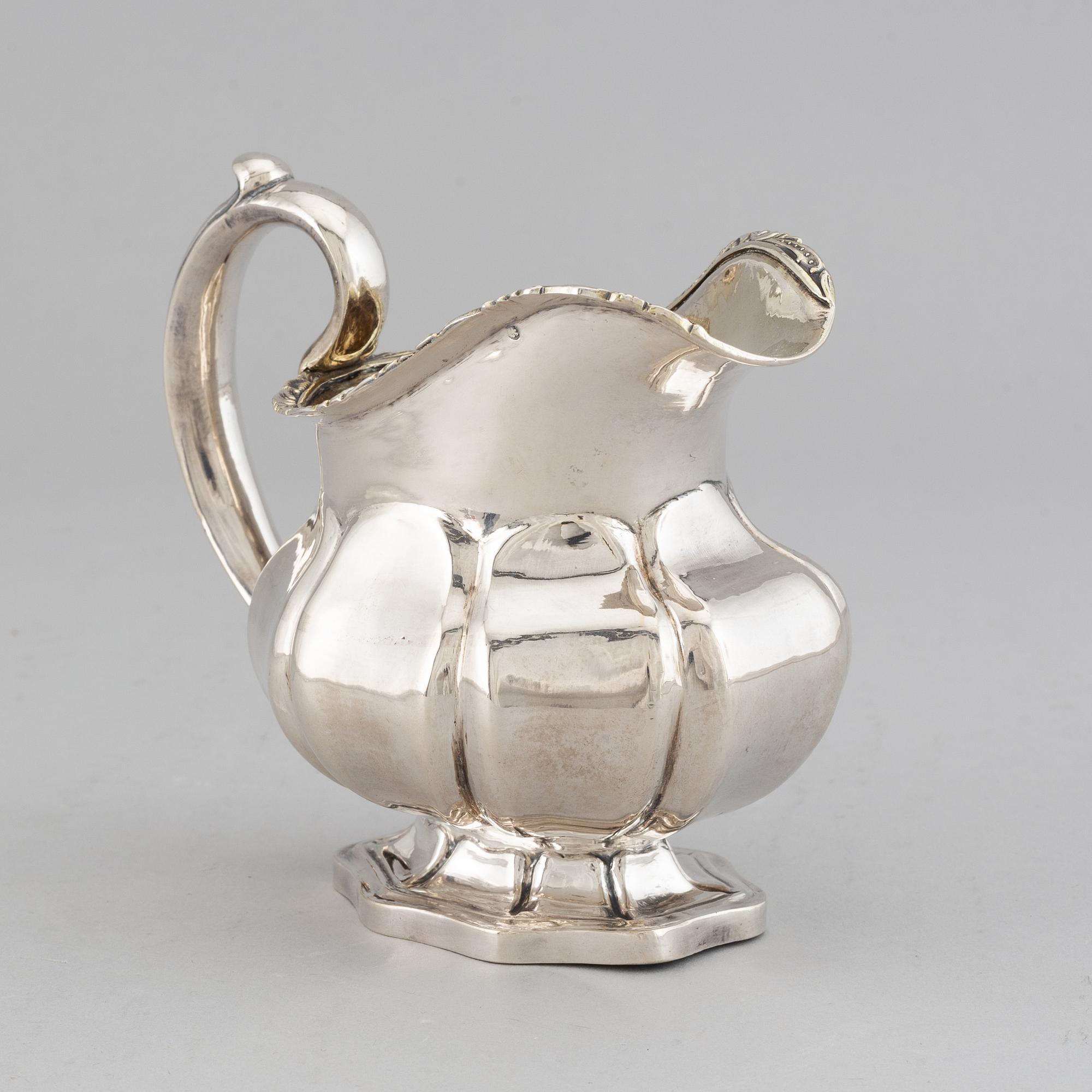A Russian 19th century parcel-gilt silver cream-jug, mark of Abraham Forstedt, St. Petersburg 1840.