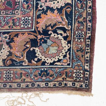 An antique/semi-antique Kerman carpet c 415 x 305 cm.